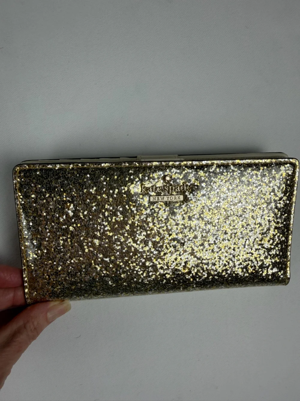 kate spade Gold Glitter Folio wallet with magnetic closure - fun and flirty